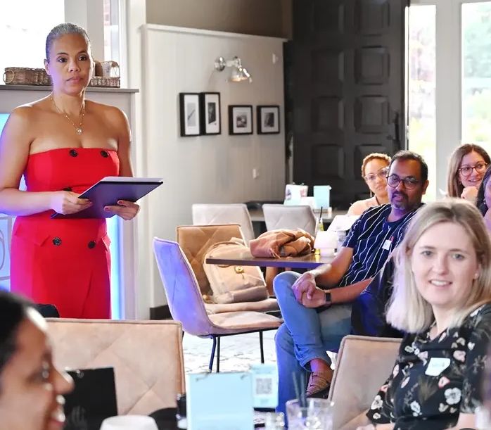 Vilma speaking to an attentive audience