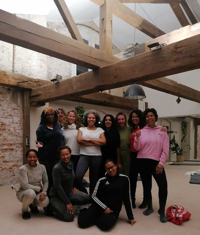 Workshop group portrait under wooden beams